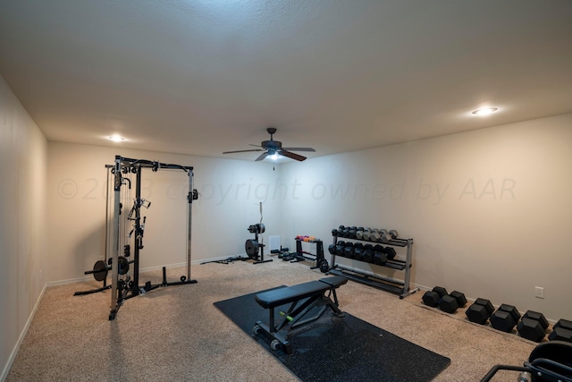 exercise area featuring baseboards and a ceiling fan