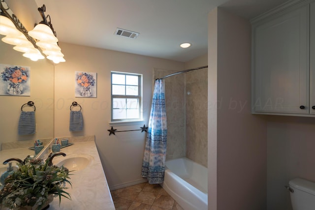 full bath with tile patterned flooring, visible vents, toilet, shower / bath combo, and vanity