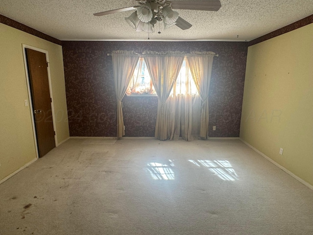 801 Skyline Dr, Borger, TX 79007 - carpeted empty room featuring ceiling fan, a textured ceiling, and wallpapered walls