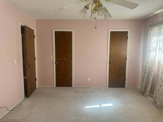 801 Skyline Dr, Borger, TX 79007 - unfurnished room with light carpet, ceiling fan, a textured ceiling, and baseboards