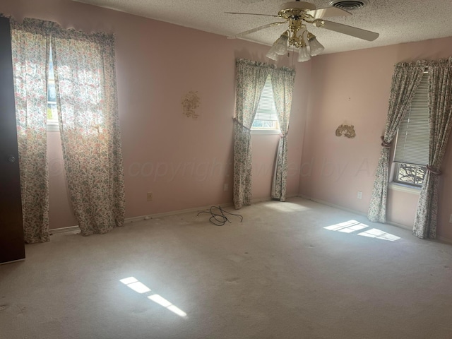 801 Skyline Dr, Borger, TX 79007 - carpeted spare room featuring ceiling fan, a textured ceiling, and baseboards