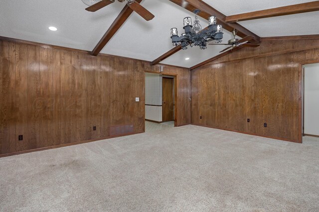 6814 Blacksmith Ln, Amarillo, TX 79109 - empty room with ceiling fan, wood walls, light carpet, and a textured ceiling