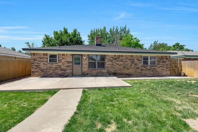 6814 Blacksmith Ln, Amarillo, TX 79109 - single story home with a patio, brick siding, and a chimney