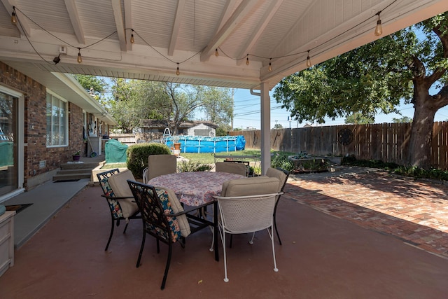 view of patio featuring a swimming pool