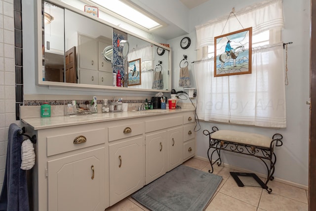 bathroom with vanity and tile patterned flooring