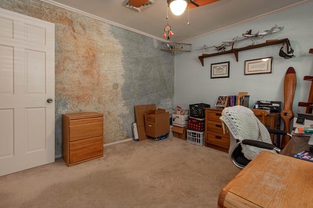 carpeted office space featuring ornamental molding