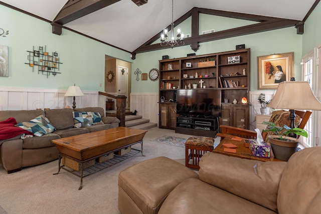 living room featuring crown molding, a chandelier, lofted ceiling with beams, and light carpet