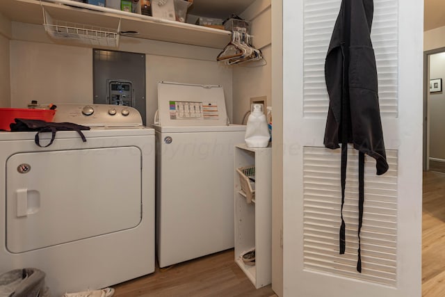 laundry room featuring hardwood / wood-style floors and independent washer and dryer