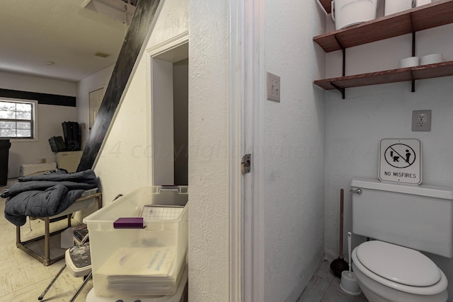 bathroom featuring toilet