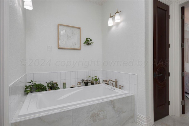 bathroom with tiled bath