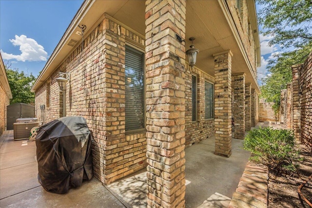 view of side of home with a patio