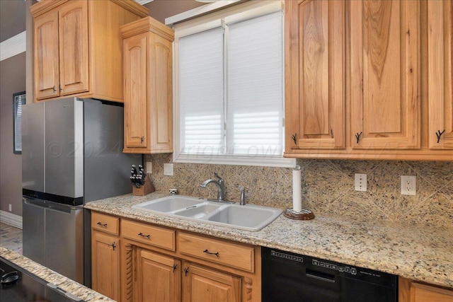 kitchen featuring stainless steel fridge, decorative backsplash, black dishwasher, and sink