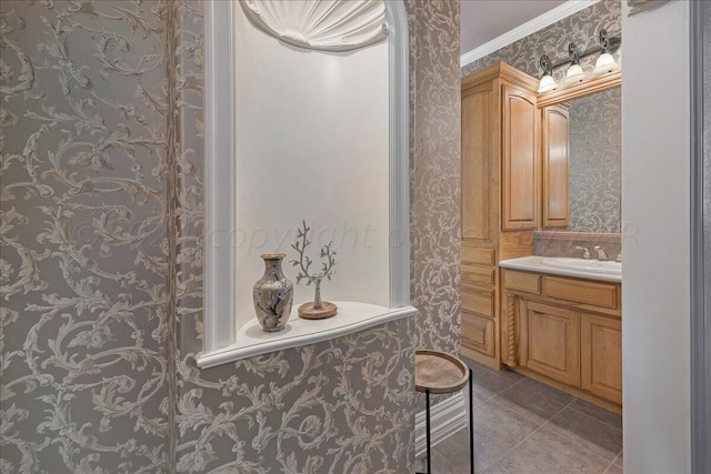 bathroom with tile patterned flooring, vanity, and ornamental molding