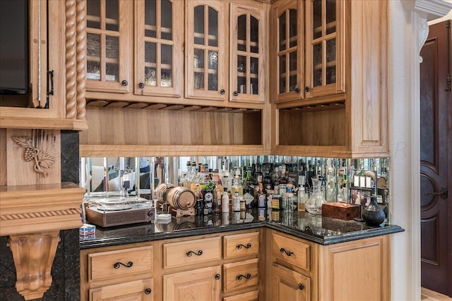 bar with dark stone countertops