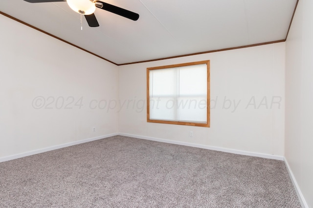 carpeted empty room with ceiling fan and ornamental molding