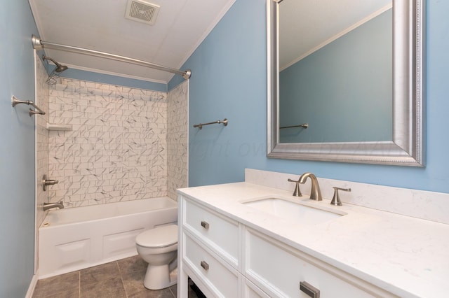 full bathroom featuring tile patterned floors, vanity, crown molding, toilet, and tiled shower / bath