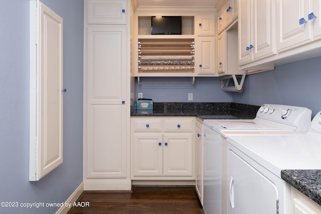 2802 S Hughes St, Amarillo, TX 79109 - laundry area featuring cabinet space, independent washer and dryer, dark wood finished floors, and baseboards