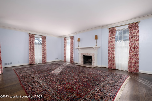 2802 S Hughes St, Amarillo, TX 79109 - unfurnished living room featuring crown molding, wood finished floors, baseboards, and a fireplace