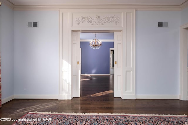 2802 S Hughes St, Amarillo, TX 79109 - interior space featuring a chandelier, dark wood-type flooring, baseboards, and ornamental molding