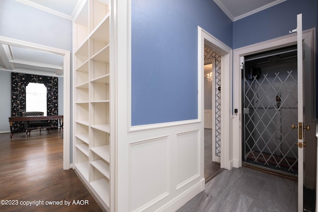 2802 S Hughes St, Amarillo, TX 79109 - entryway featuring crown molding, a wainscoted wall, dark wood-style floors, and a decorative wall