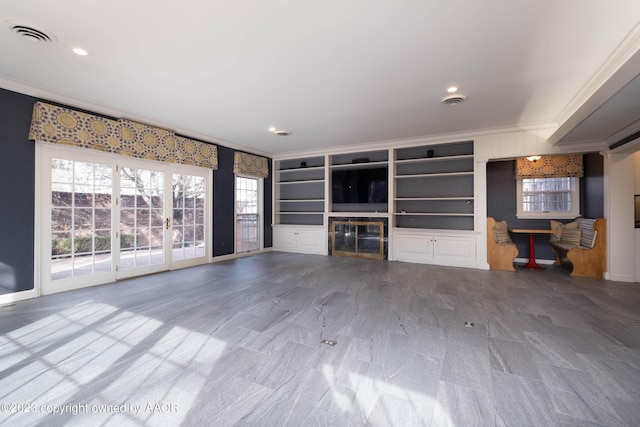 2802 S Hughes St, Amarillo, TX 79109 - unfurnished living room with crown molding, a glass covered fireplace, baseboards, recessed lighting, and built in shelves