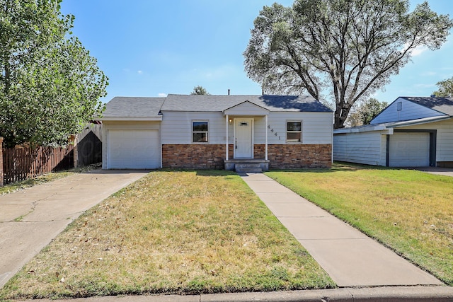 ranch-style house with a front yard and a garage