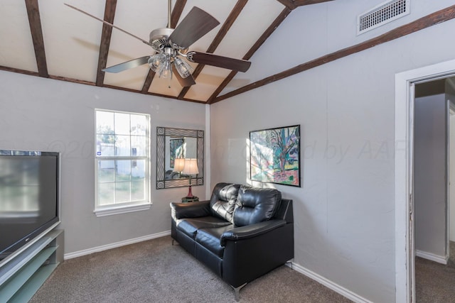 sitting room with a ceiling fan, carpet floors, vaulted ceiling, and visible vents