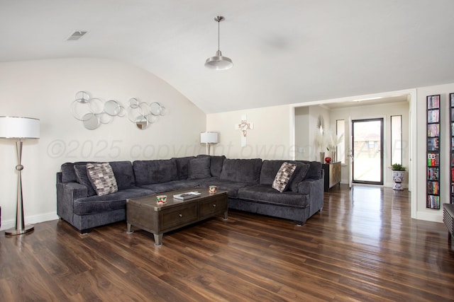 living room with visible vents, baseboards, wood finished floors, and lofted ceiling