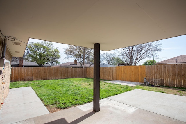 view of yard with a patio area and a fenced backyard