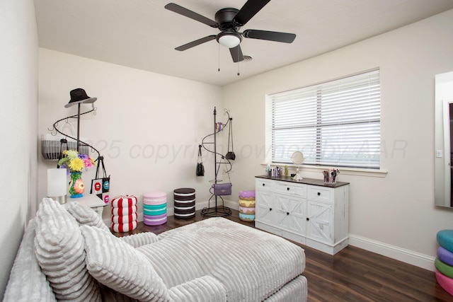 bedroom featuring dark wood-style flooring, baseboards, and a ceiling fan