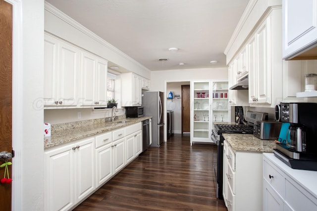 kitchen with open shelves, under cabinet range hood, dark wood-type flooring, stainless steel appliances, and a sink