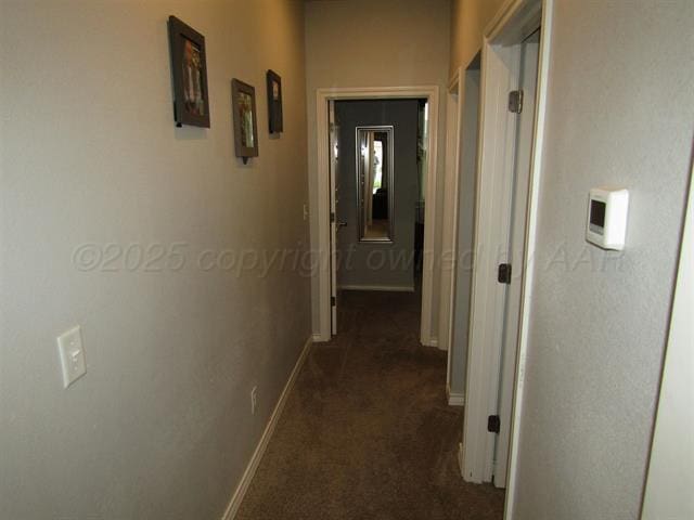 corridor with dark carpet