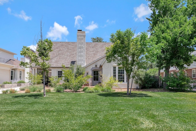 2215 S Hughes St, Amarillo, TX 79109 - back of property with a yard, brick siding, a chimney, and a shingled roof