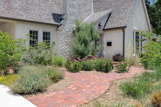 2215 S Hughes St, Amarillo, TX 79109 - view of home's exterior featuring brick siding and a shingled roof