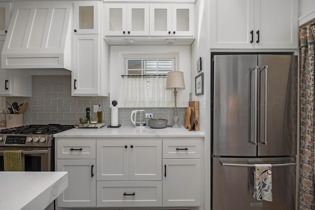 2215 S Hughes St, Amarillo, TX 79109 - kitchen featuring stainless steel appliances, custom exhaust hood, white cabinets, and tasteful backsplash