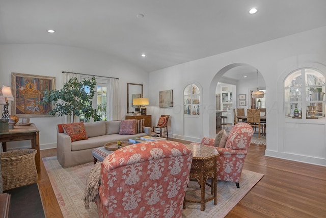 2215 S Hughes St, Amarillo, TX 79109 - living area featuring arched walkways, wood finished floors, lofted ceiling, and recessed lighting