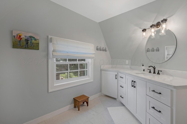 2215 S Hughes St, Amarillo, TX 79109 - bathroom with vanity, lofted ceiling, and marble finish flooring