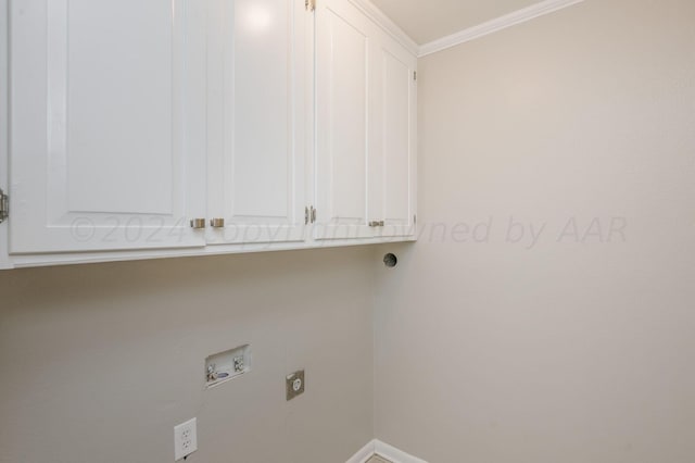 laundry room with crown molding, hookup for an electric dryer, hookup for a washing machine, baseboards, and cabinet space
