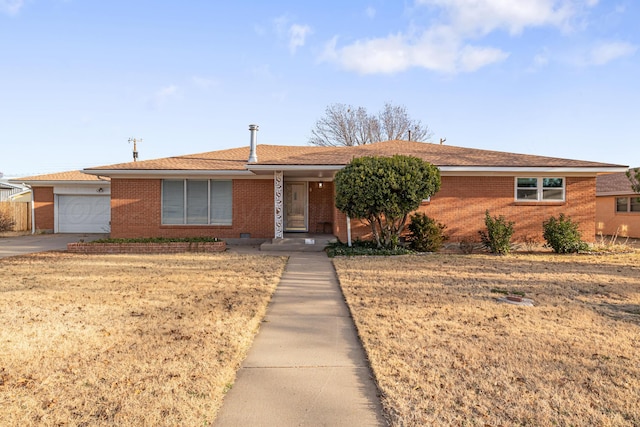 single story home with a front lawn and a garage