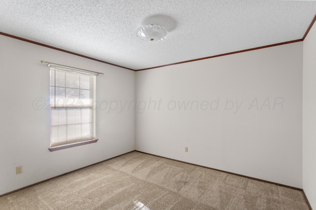 carpeted spare room featuring a textured ceiling