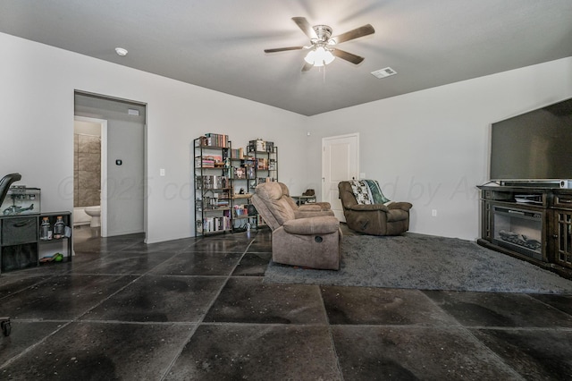 living area with a ceiling fan