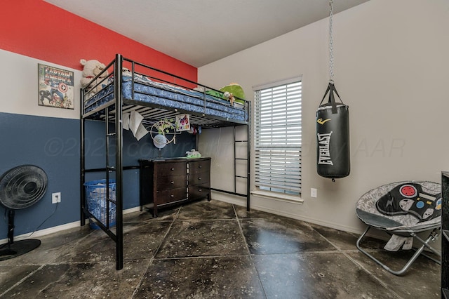 bedroom featuring baseboards