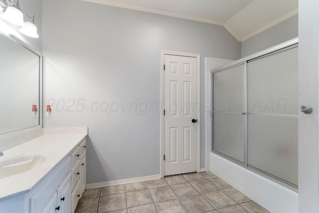 full bathroom featuring ornamental molding, shower / bath combination with glass door, vanity, and tile patterned floors