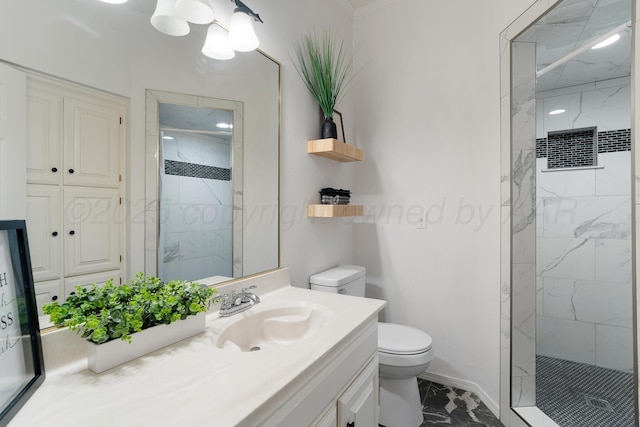 bathroom with toilet, marble finish floor, a marble finish shower, and vanity