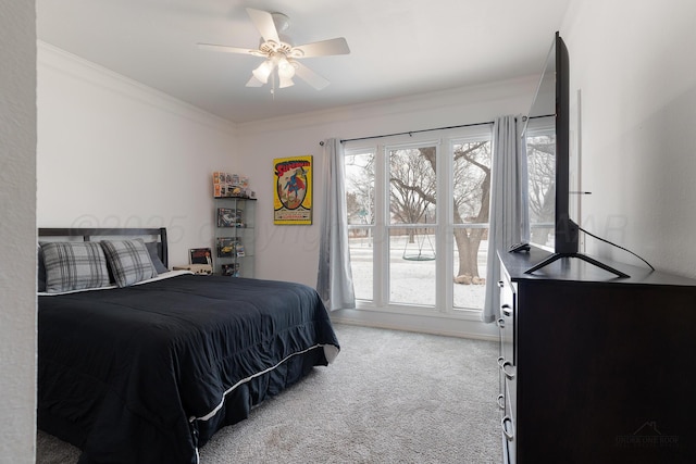 bedroom featuring light carpet, ceiling fan, and crown molding