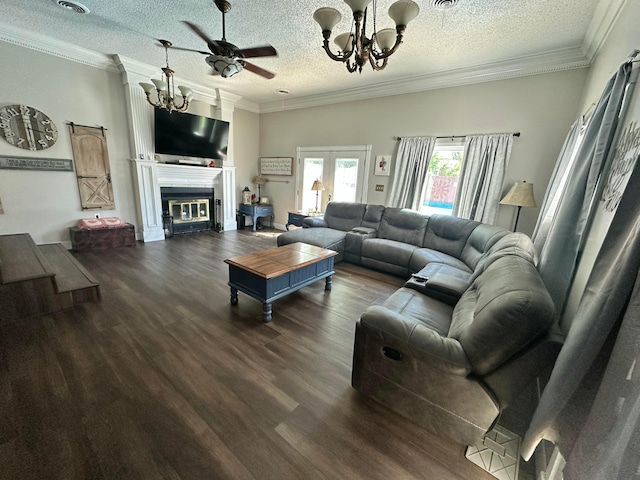 219 Inverness St, Borger, TX 79007 - living area with a chandelier, a ceiling fan, dark wood-type flooring, a textured ceiling, and ornamental molding