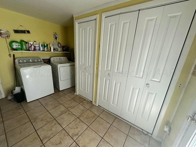 219 Inverness St, Borger, TX 79007 - laundry area with washer and clothes dryer and light tile patterned flooring