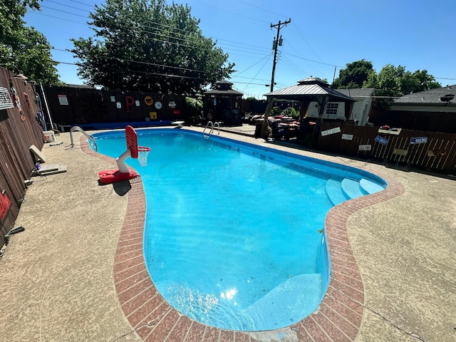 219 Inverness St, Borger, TX 79007 - view of pool featuring a gazebo and a fenced backyard