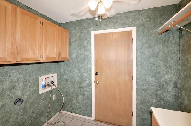laundry area with hookup for a washing machine, cabinet space, a ceiling fan, and tile patterned floors