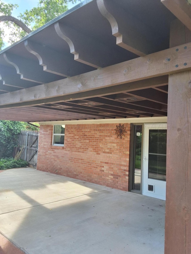 view of patio / terrace featuring fence